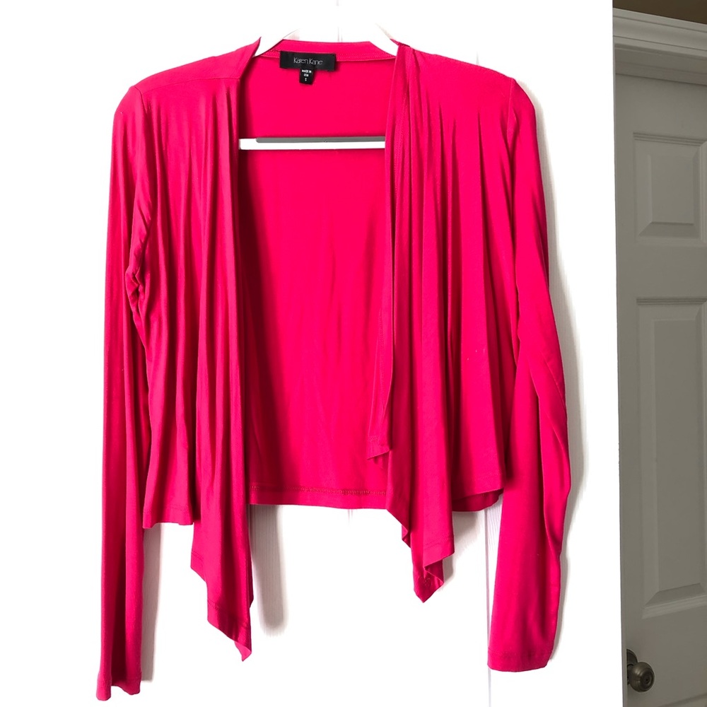 Pink open front cardigan.